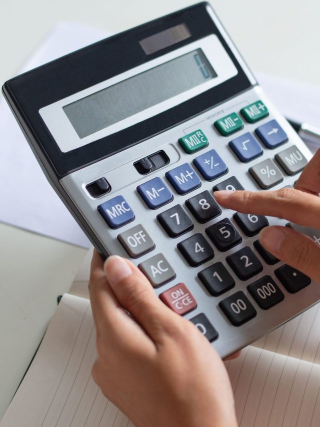 cropped-close-up-accountant-using-calculator-while-examining-report-1-scaled-1.jpg