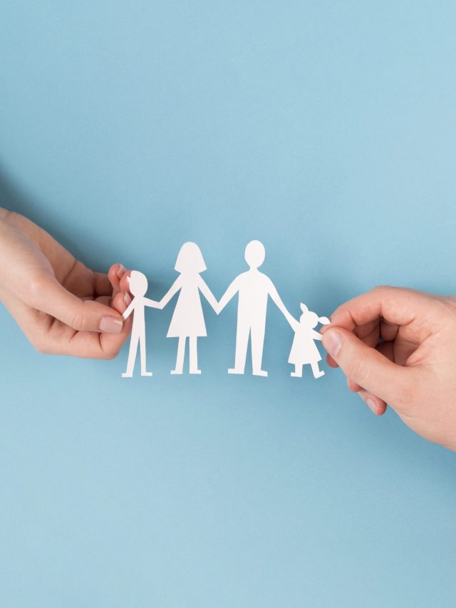 top-view-people-holding-hands-cute-paper-family