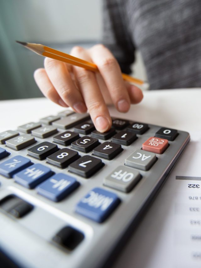 closeup-of-accountant-hands-counting-on-calculator